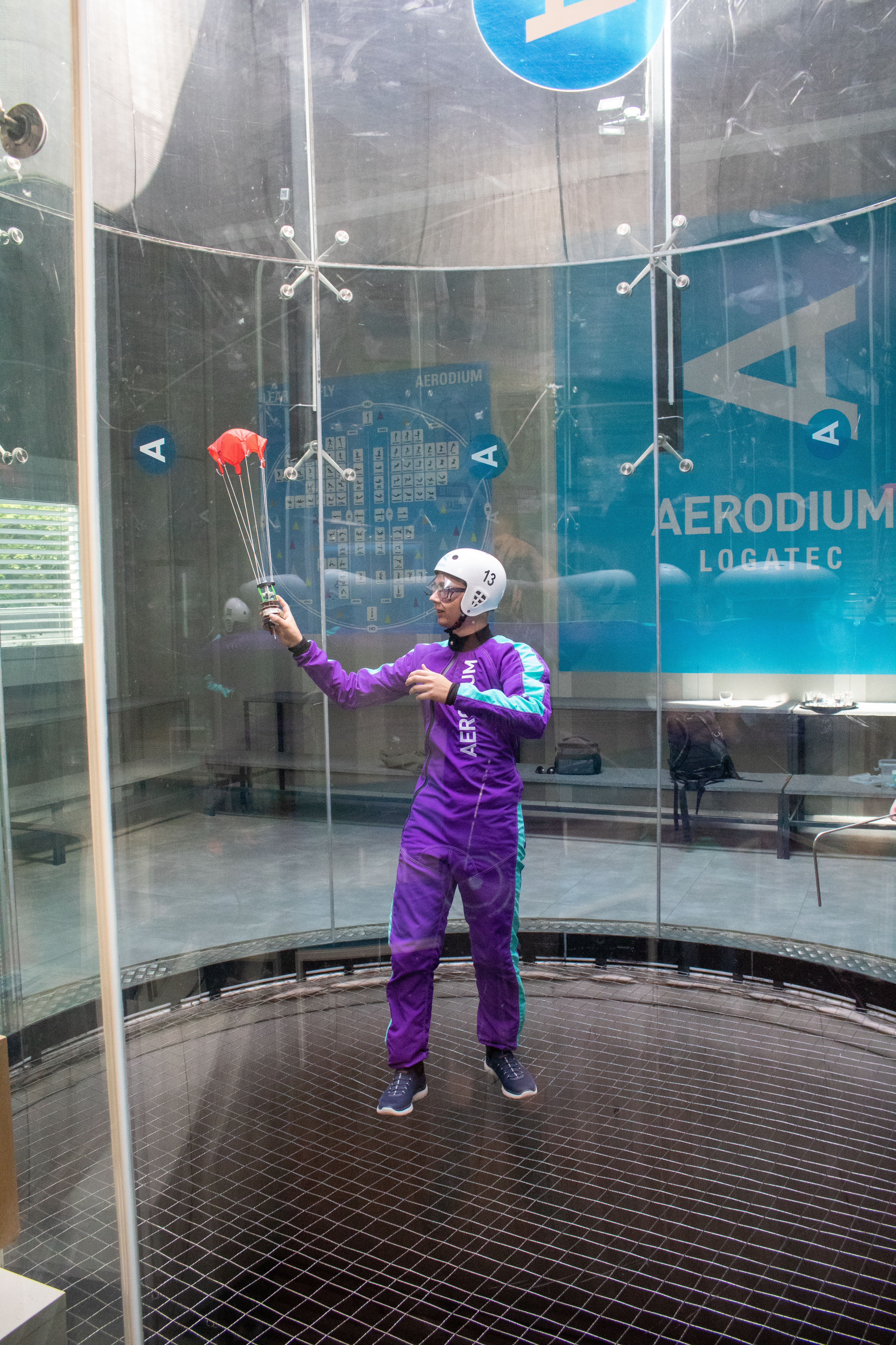 Team member holding cansat in wind tunnel